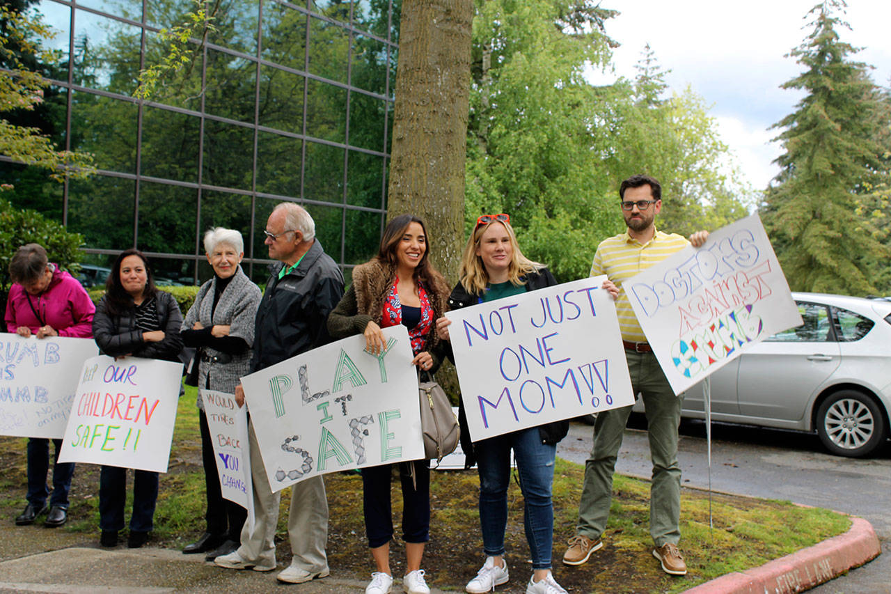 Parents and community members protest the Bellevue School Board’s decision to implement crumb rubber infill on its artificial turf fields during the board’s May 16 meeting. Both the city and school district in Mercer Island are facing the same issue. Madison Miller/Bellevue Reporter