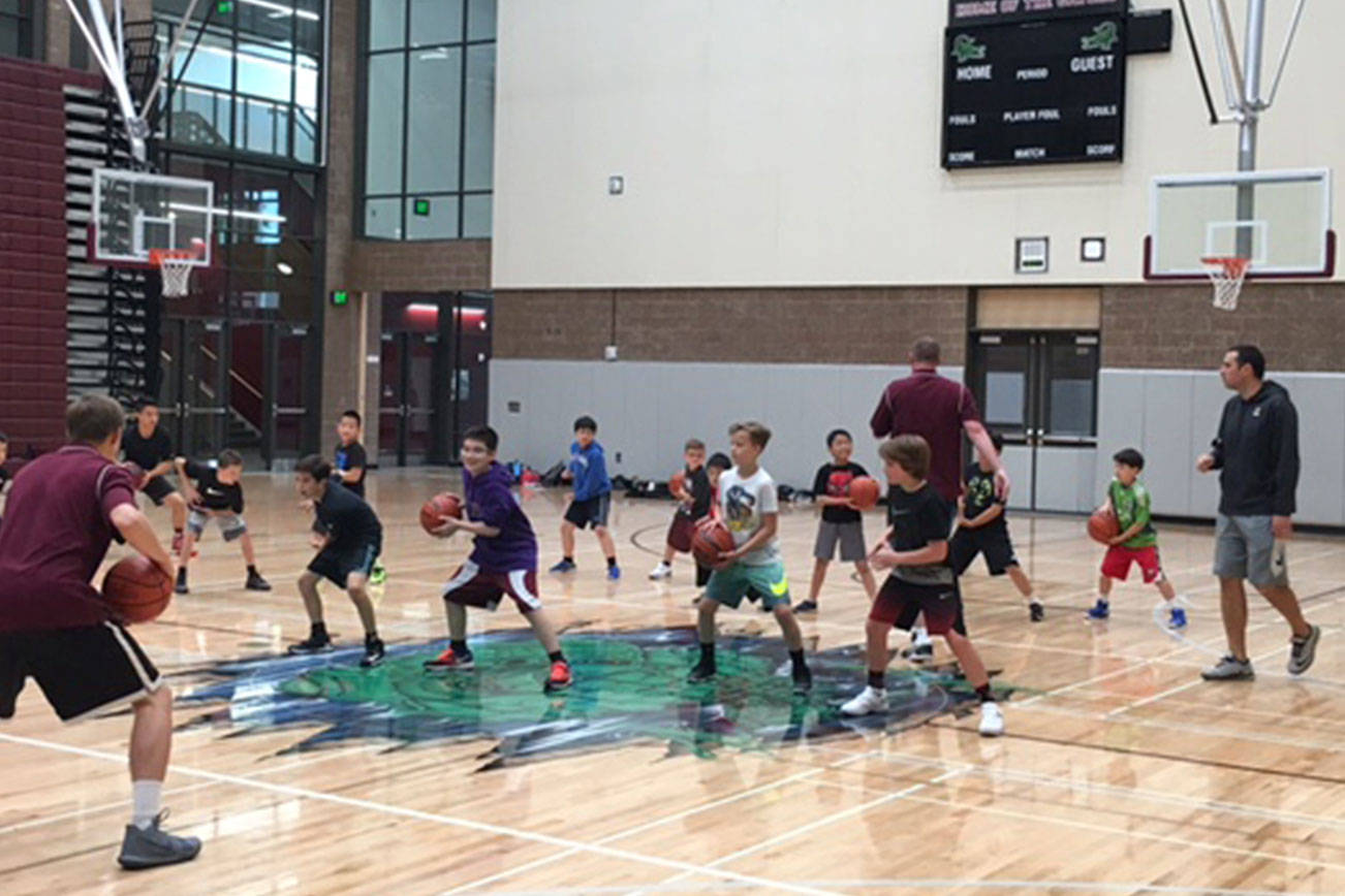 Crawford interacts with kids at his Mercer Island hoops camp