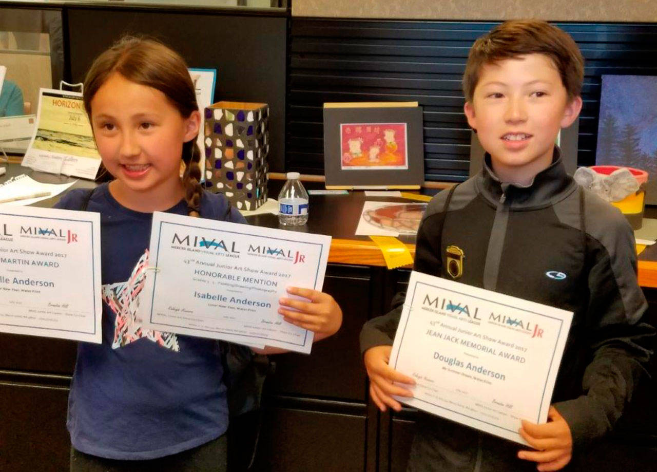 Isabelle Anderson, grade 3 winner of the Franca Martin Award for her water print “Lunar New Year,” and Douglas Anderson, grade 4 winner of the Jean Jack Memorial Award for his water print “My Summer Dream,” pose at the MIVAL Junior Art Show on July 8. Photo courtesy of Raleigh Nowers