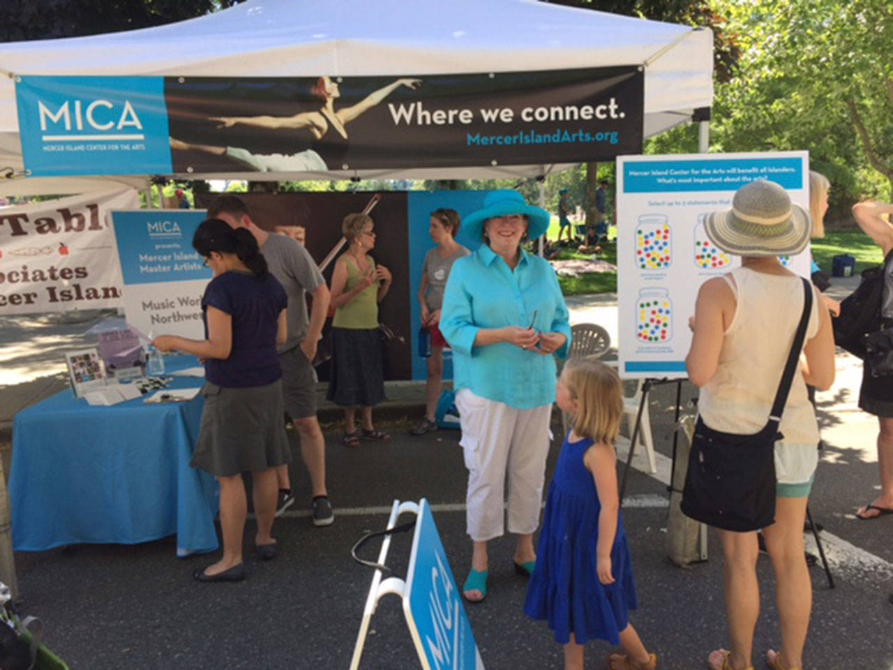 MICA board members Stacy Duel and Sue Sherwood, with MICA staffers Keith Imper and Jami Cairns, answer questions at the MICA booth at the Farmers Market. Photo courtesy of Keith Imper