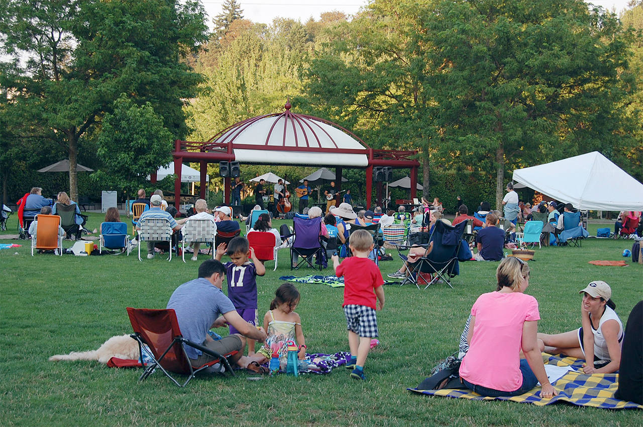 Islanders enjoy a Mostly Music in the Park concert on the Mercerdale lawn. File photo