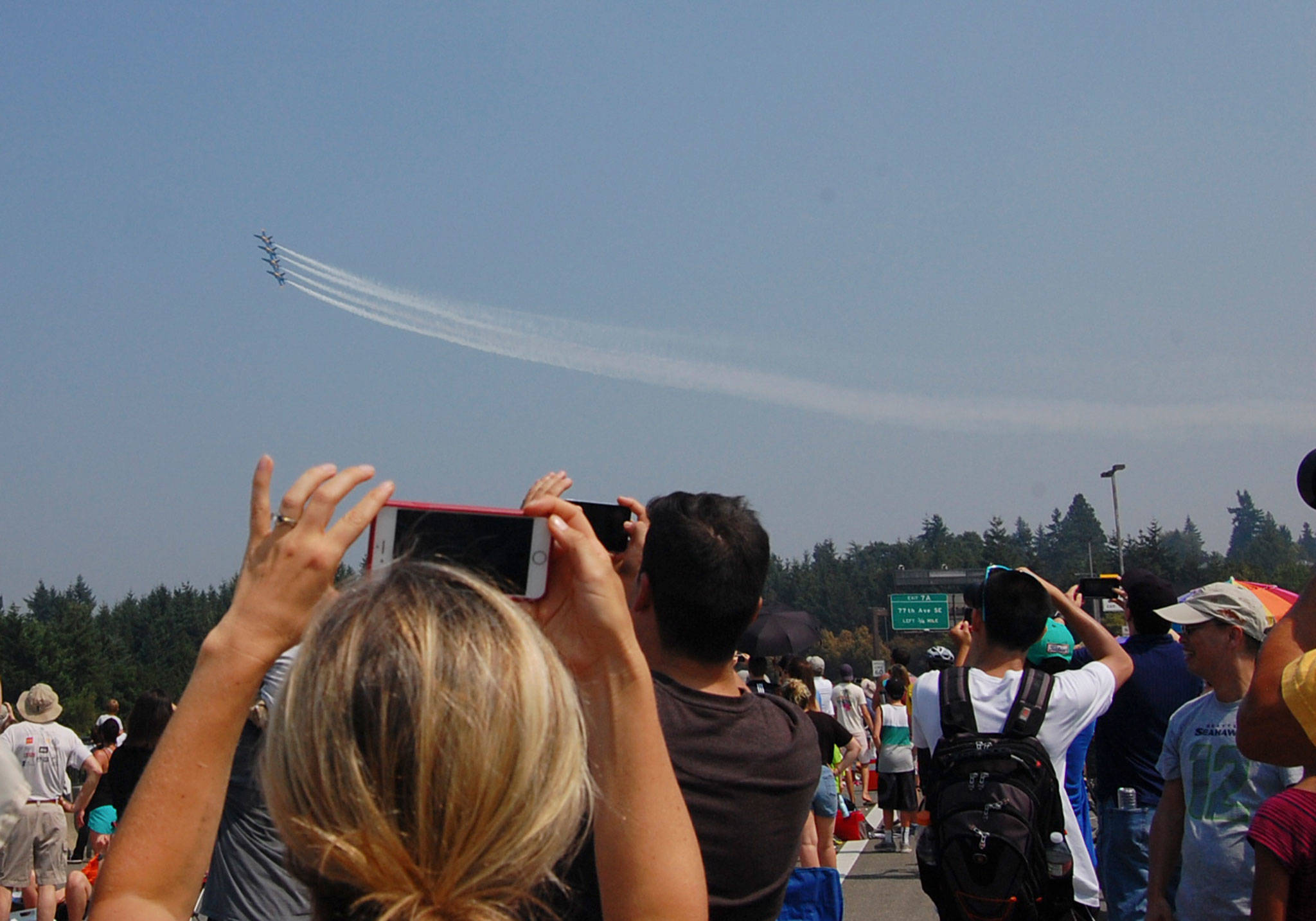 The Blue Angels fly over Mercer Island as spectators capture cell phone videos. Katie Metzger/staff photo