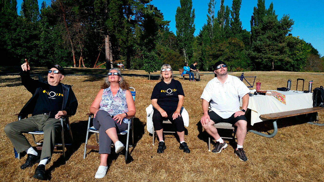 The solar eclipse wows a group of onlookers at Luther Burbank Park on Monday morning. Photo courtesy of Diane Mortenson/Mercer Island Parks and Recreation
