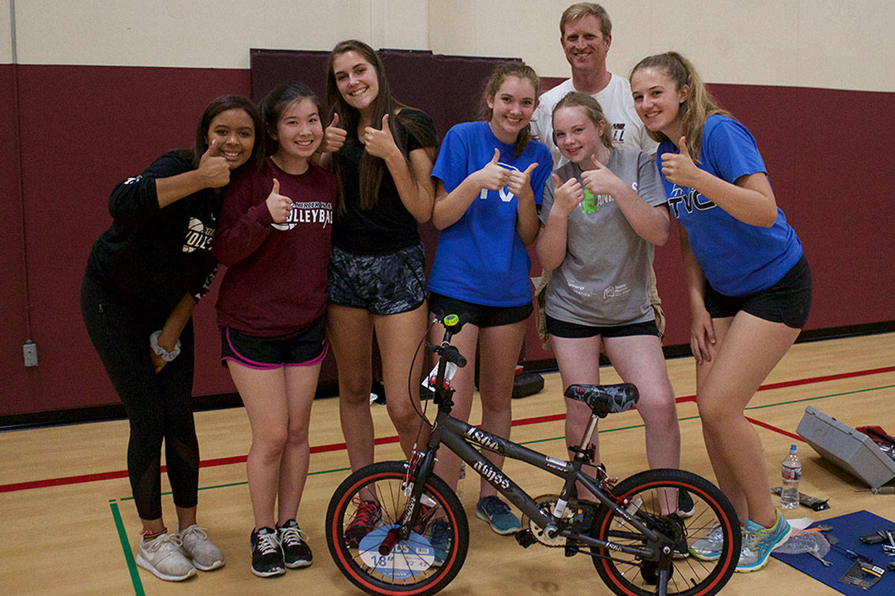 MIHS girls’ volleyball team bonds by building bikes