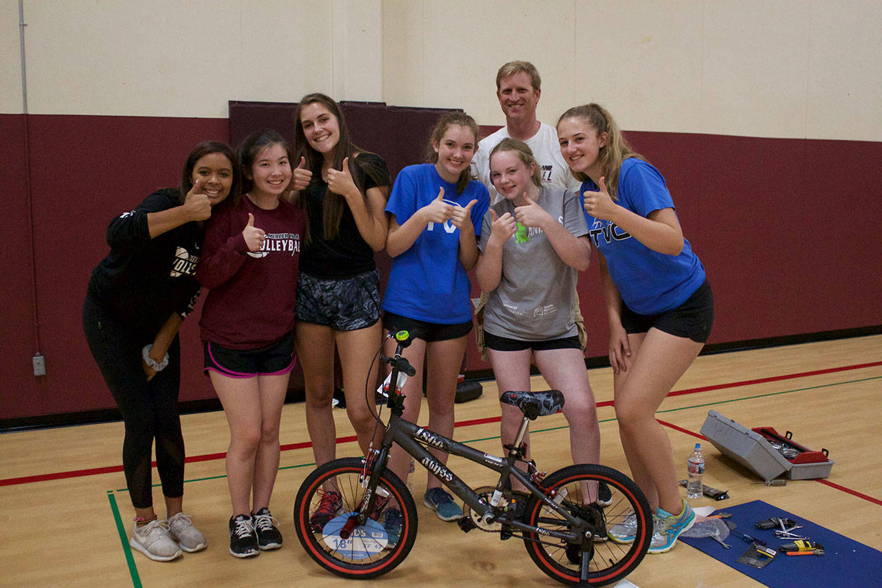 Mercer Island High School volleyball players assembled and donated six bikes as part of a team bonding activity on Aug. 25. The bikes were donated to a Mercer Island family identified through Youth and Family Services. Photos courtesy of Elise Quinn