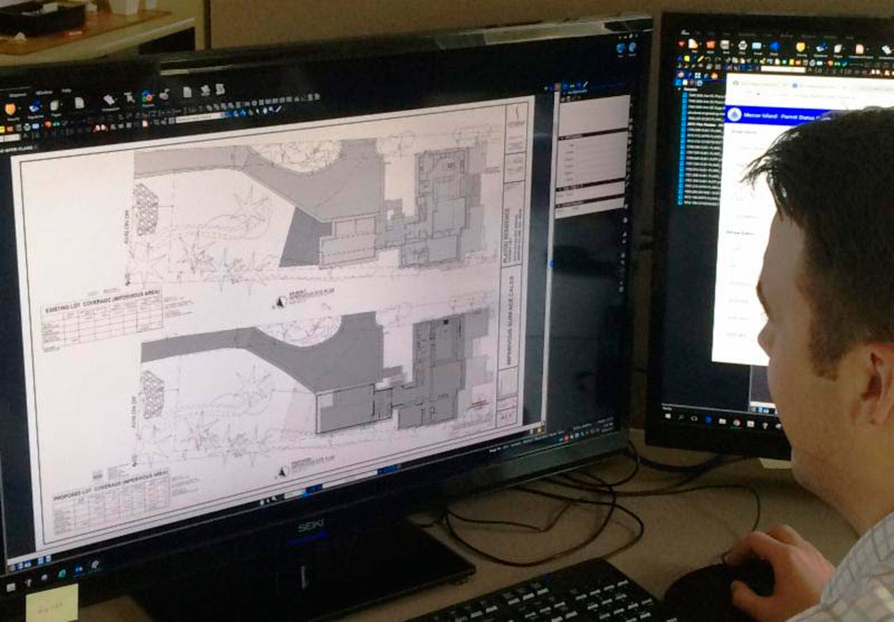 Charlie Misner, one of the city’s plans examiners, works to process permits amid a 10-year high in Mercer Island. Photo courtesy of the city of Mercer Island