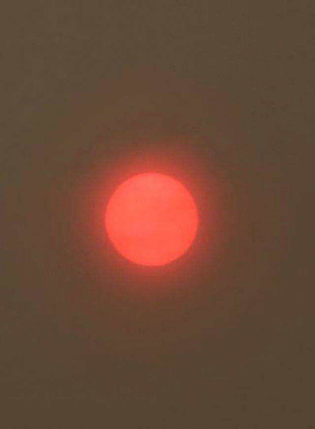 A hazy red sun this morning was caused by wildfires. Andy Nystrom/Redmond Reporter