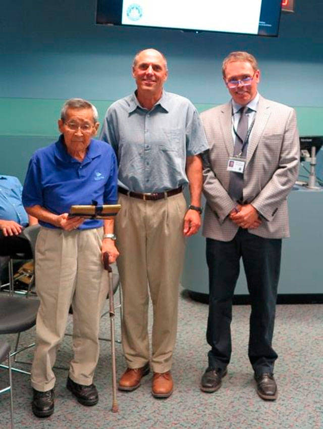 Jack Sameshima, left, receives his award from Mayor Bruce Bassett and MIYFS Manager Derek Franklin. Photo courtesy of the city of Mercer Island