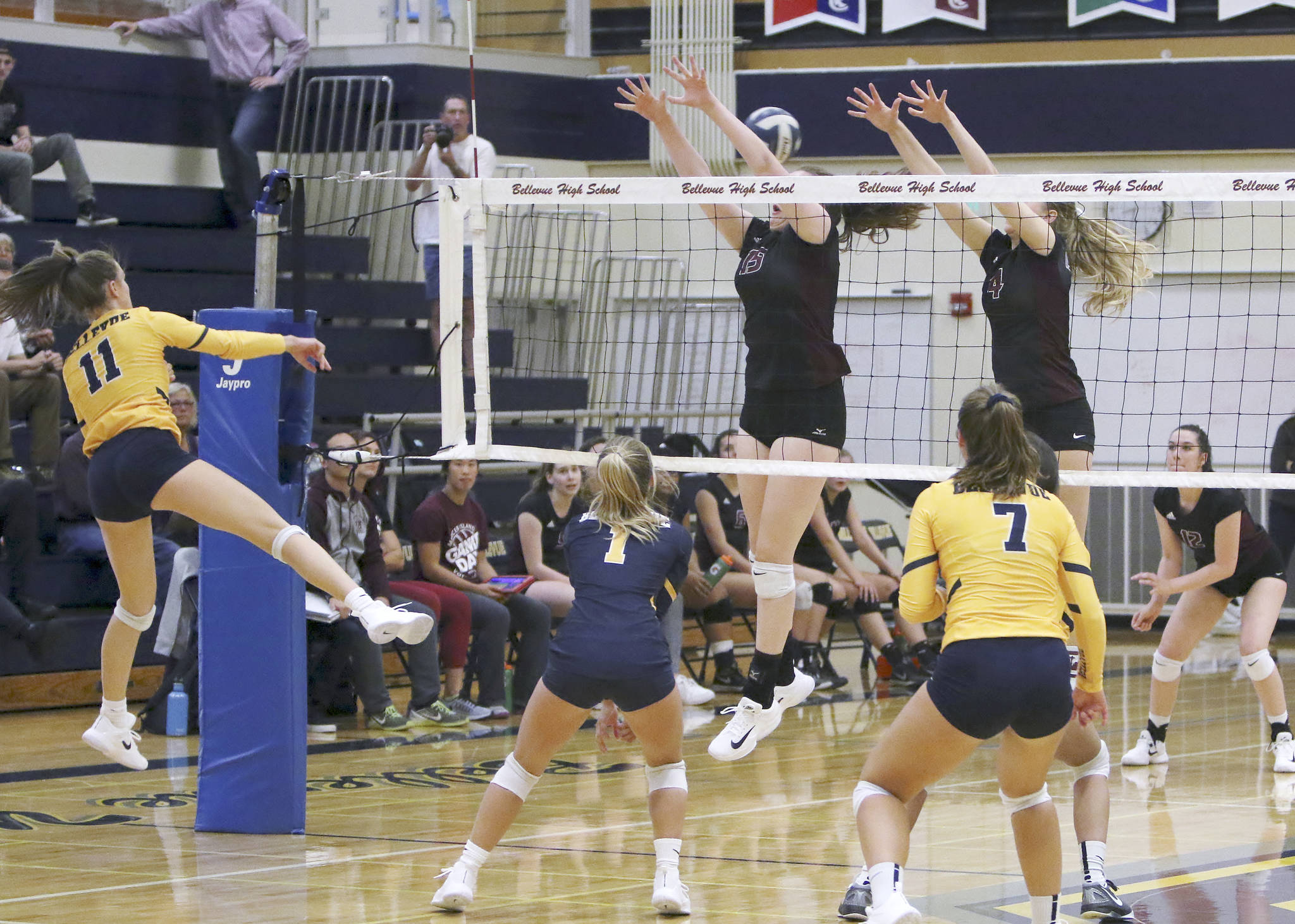 Photo courtesy of Jim Nicholson                                Mercer Island junior Tessa Fisk, left, and Quinn Casey, right, leap for the ball against the Bellevue Wolverines in a matchup between KingCo 3A powerhouses on Sept. 20 at Bellevue High School. Mercer Island defeated Bellevue 3-1 (25-23, 26-24, 17-25, 25-21).