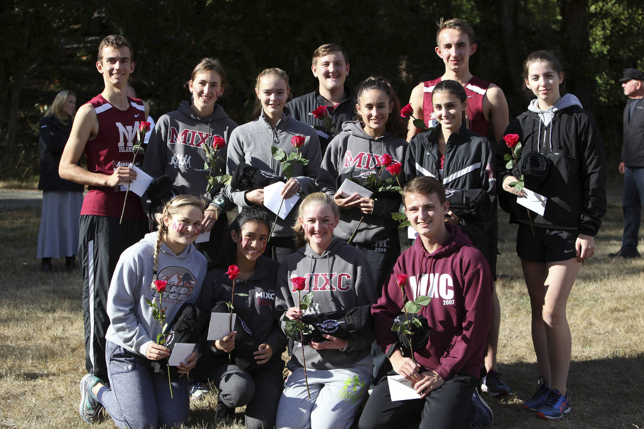 Photo courtesy of Jay Na                                The Mercer Island girls and boys cross country teams put together memorable performances on senior night on Sept. 20 at Luther Burbank Park in Mercer Island.                                The Islanders girls squad captured first place in the meet, tallying 36 total team points (low score wins in cross country). Lake Washington finished in second place with 38 points and Liberty collected third place with 46 points. Mercer Island junior Margaret Baker finished in first place in the meet with a time of 19 minutes, 51 seconds.                                Islanders’ senior Mary Rose Vu earned second place with a time of 20:32. Mercer Island senior Chloe Michaels registered an eighth-place finish (21:33).                                In boys action, Liberty tallied a first place showing with 26 points. Lake Washington earned second place with 38 points and Mercer Island finished in third place with 68 team points. Islanders’ junior Alexander Benson finished in sixth place with a time of 18:03. Jaden Krauser finished in eight place with a time of 18:24.                                Mercer Island senior cross country athletes on the girls and boys squads are pictured in the above photo.