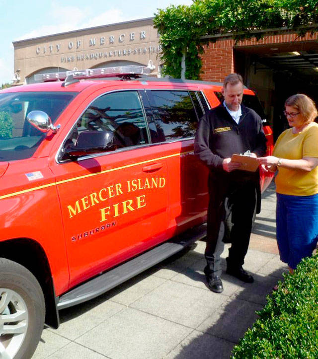 Betsy Zuber with Mercer Island Youth and Family Services, right, consults with Mercer Island Fire Department Battalion Chief Shawn Matheson. Photo courtesy of the city of Mercer Island