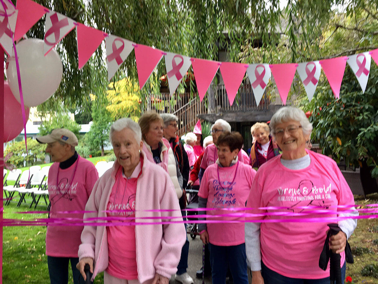 Covenant Shores residents and breast cancer survivors wait behind the starting line at the Making Strides Against Breast Cancer walk on Sept. 30. Photo courtesy of Greg Asimakoupoulos