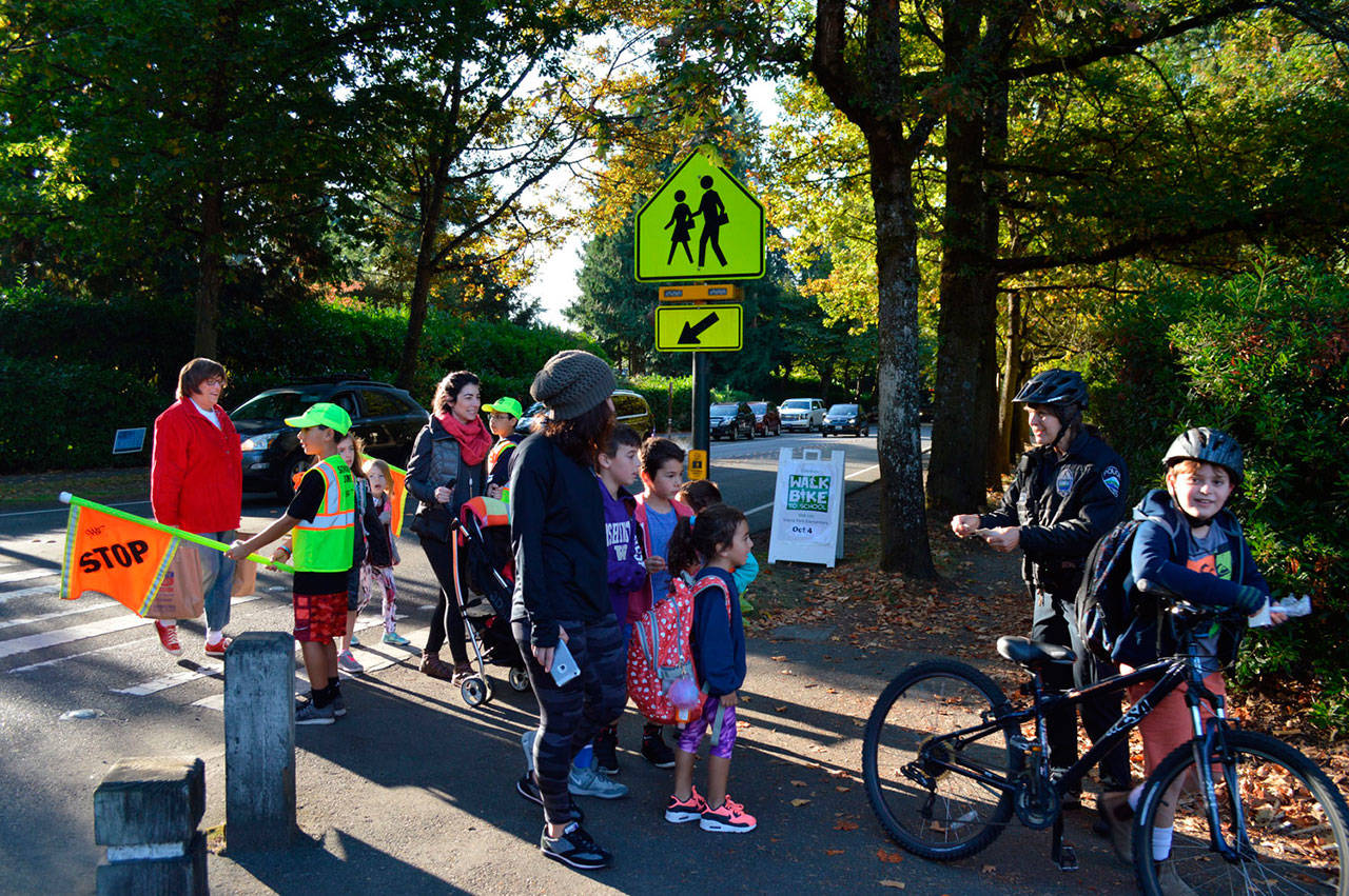 MIPD Officer Anna Ormsby welcomes walkers and bikers at Island Park Elementary for Walk and Bike to School Day on Oct. 4. Photo courtesy of Craig Degginger/Mercer Island School District