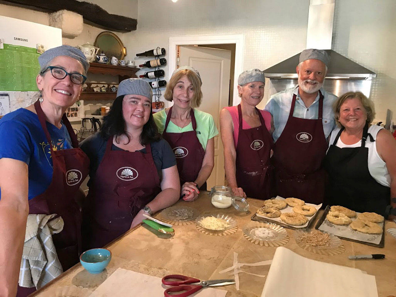Students in a Pilgrims au Pain class learn how to prepare bread to bake in a wood-fired oven. Photo courtesy of Ann Lokey