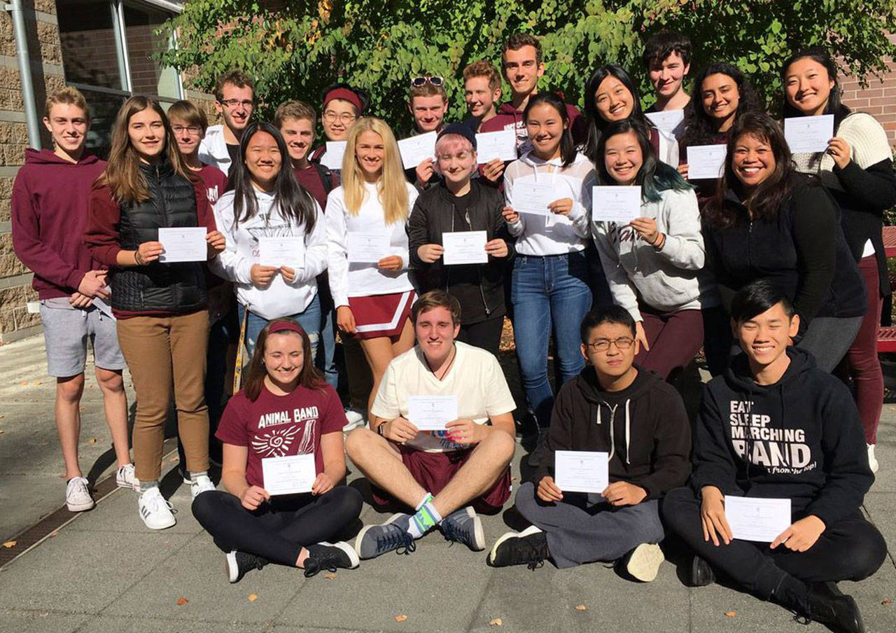 MIHS seniors pose with their letters of commendation from the National Merit program. Photo courtesy of the Mercer Island School District