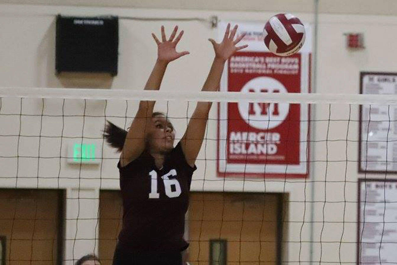 Photo courtesy of Don Borin/Stop Action Photography                                Mercer Island senior Adara Hamilton makes a key block in a contest earlier this season against the Liberty Patriots this past September. The Islanders swept the Lake Washington Kangaroos 3-0 (25-15, 25-9, 25-12) on Oct. 18 on senior night.