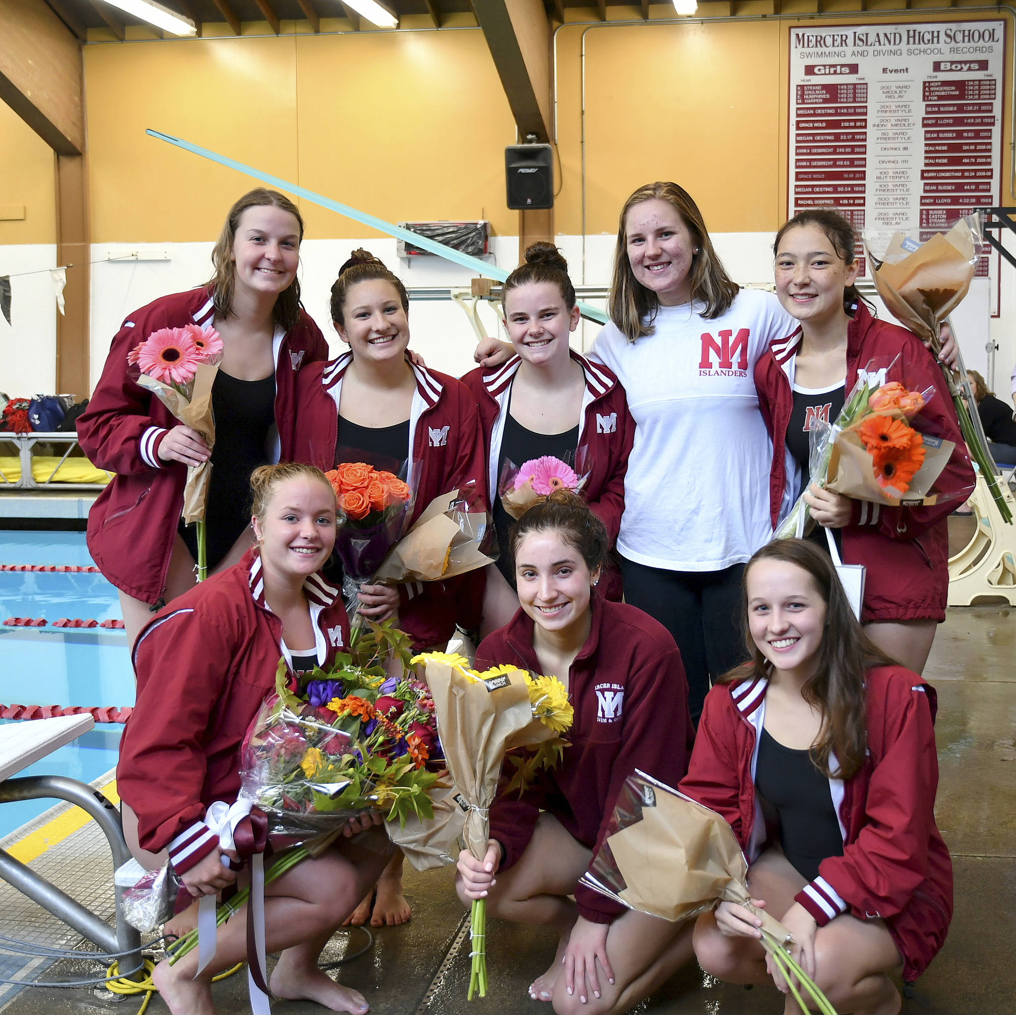 Photo courtesy of Allison Needles                                Mercer Island girls swim team seniors Tess Ritcey, Lauren Ralph, Caroline Harkins, Landon Cobbs, Kathryn Ristuben, Taylor Winnie, Ellie Williams and Haley Crowther gathered for a picture before the Islanders competed against the Sammamish Totems on senior night, Oct. 12. Mercer Island defeated Sammamish 127-58 in the meet. The Islanders improved their overall record to 7-0 with the win.                                Mercer Island athletes capturing first place against the Totems consisted of Sophia McGuffin (1-meter dive), Alexandra Williams (200 medley relay), Annie Pearse (200 medley relay, 200 free relay, 200 IM, 100 breaststroke), Mira Tang (200 medley relay) Julia Williamson (200 medley relay), Chloe Mark (200 free relay, 200 free), Elizabeth Bailey (200 free relay), Hailey Vandenbosch (200 free relay, 50 free), Ellie Nomicos (500 free), Ritcey (400 free relay), Harkins (400 free relay), Williams (400 free relay) and Ralph (400 free relay).