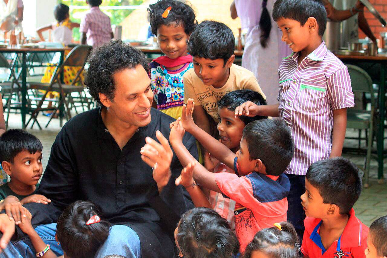 Ajit George, Shanti Bhavan’s director of operations, with children at the educational nonprofit. Photo courtesy of Shanti Bhavan