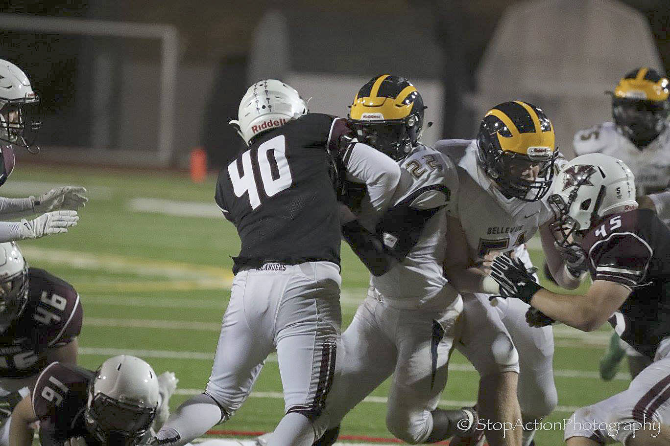 Photo courtesy of Don Borin/Stop Action Photography                                Mercer Island middle linebacker William Mulflur (No. 40) tackles Bellevue running back Isaiah Ifanse in a contest between rivals on Oct. 13. Mulflur landed a job in the starting lineup in his first-ever season of high school football during the 2017 season.