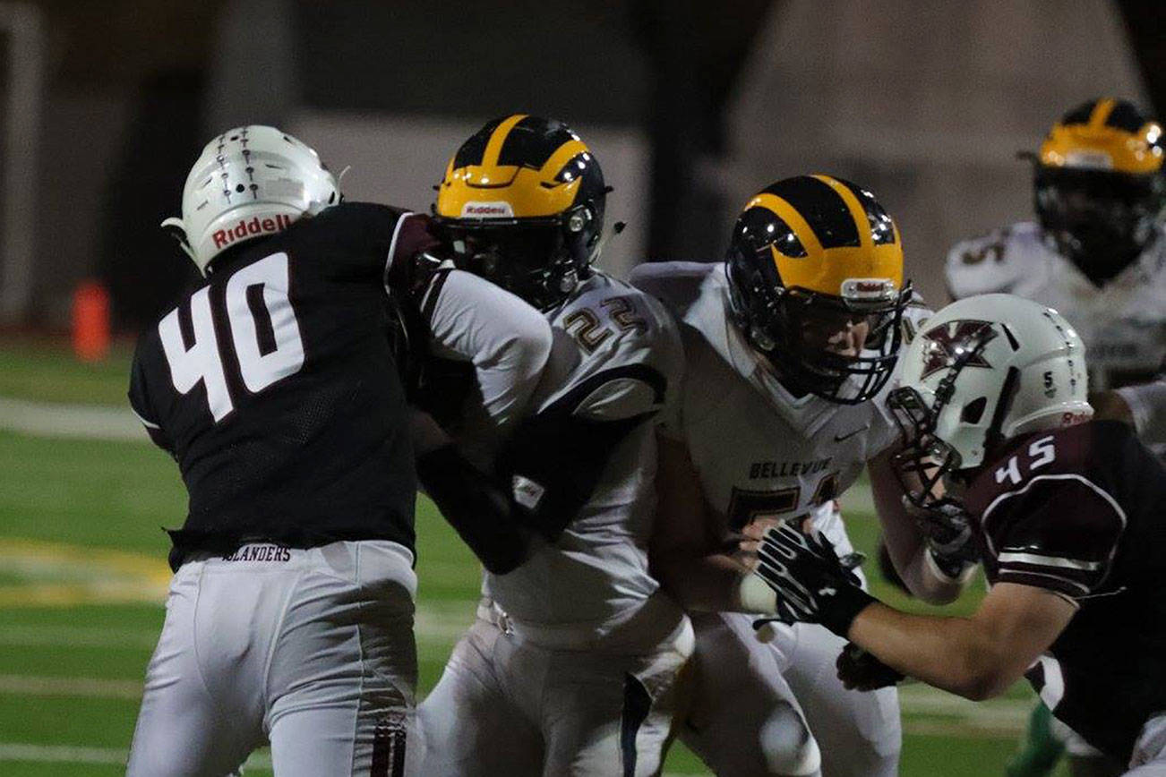 Photo courtesy of Don Borin/Stop Action Photography                                Mercer Island middle linebacker William Mulflur (No. 40) tackles Bellevue running back Isaiah Ifanse in a contest between rivals on Oct. 13. Mulflur landed a job in the starting lineup in his first-ever season of high school football during the 2017 season.