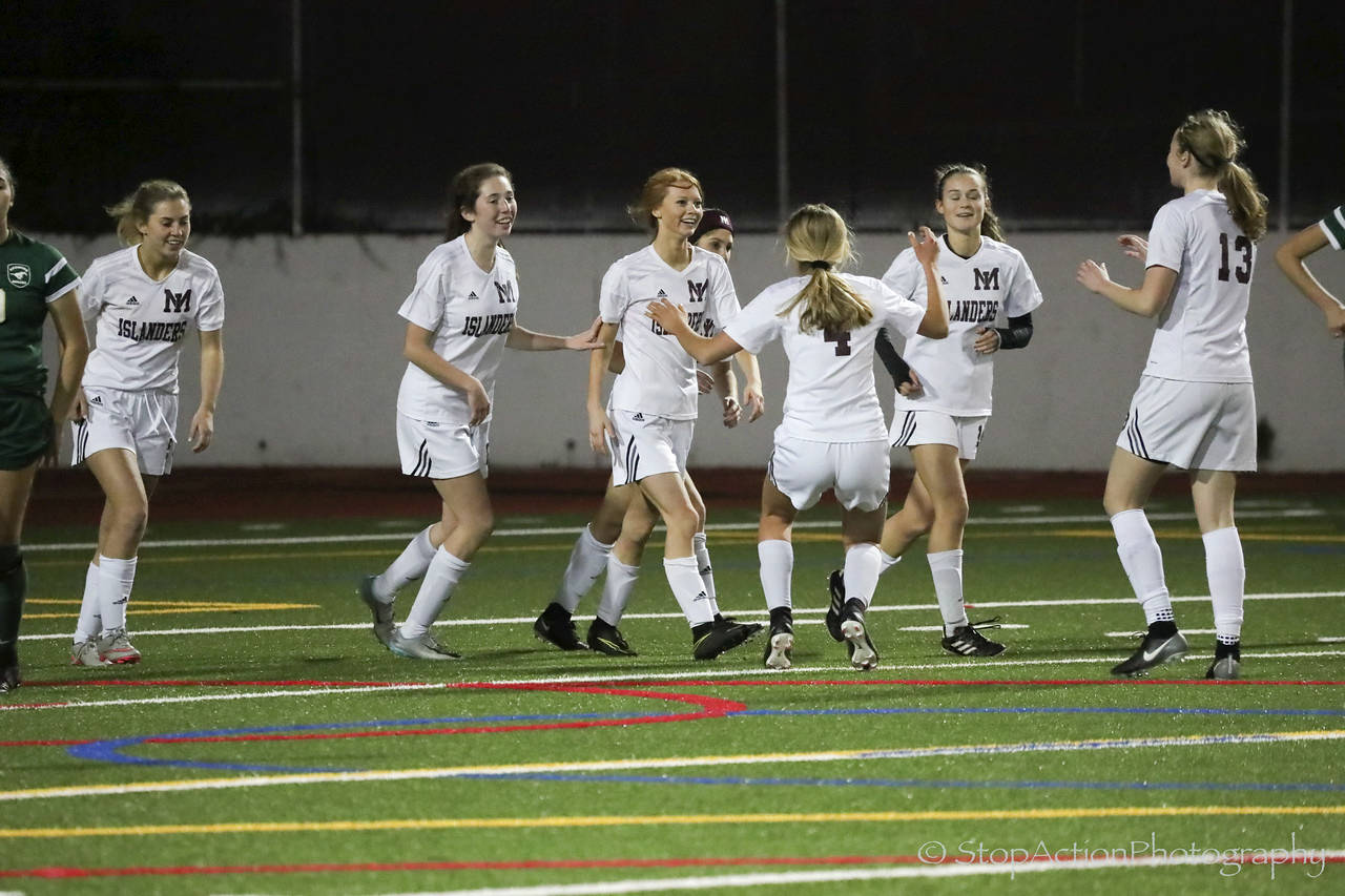 Photo courtesy of Don Borin/Stop Action Photography                                The Mercer Island Islanders earned a 3-0 win against the Redmond Mustangs in the Class 3A KingCo championship game on Oct. 31 at Mercer Island High School. The victory in the KingCo 3A title game clinched the Islanders a berth in the Class 3A state tournament. Mercer Island midfielder Jessie Stenberg scored two goals in the win. Islanders’ junior midfielder Jackie Gilroy added a goal as well.