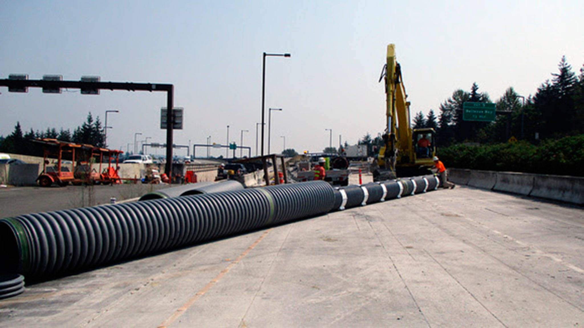 Crews install protective casing for utility lines near the future Mercer Island station. Photo courtesy of Sound Transit