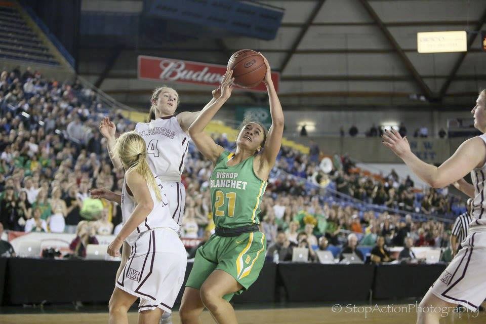 Photo courtesy of Don Borin/Stop Action Photography                                Mercer Island girls basketball player Claire Mansfield, left, leaps into the air while playing defense in the Class 3A state championship game in March 2017.