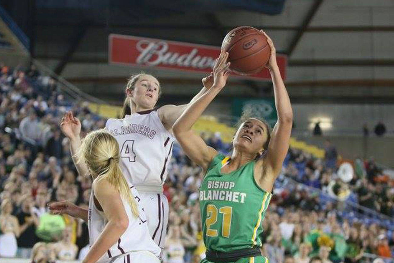 Photo courtesy of Don Borin/Stop Action Photography                                Mercer Island girls basketball player Claire Mansfield, left, leaps into the air while playing defense in the Class 3A state championship game in March 2017.