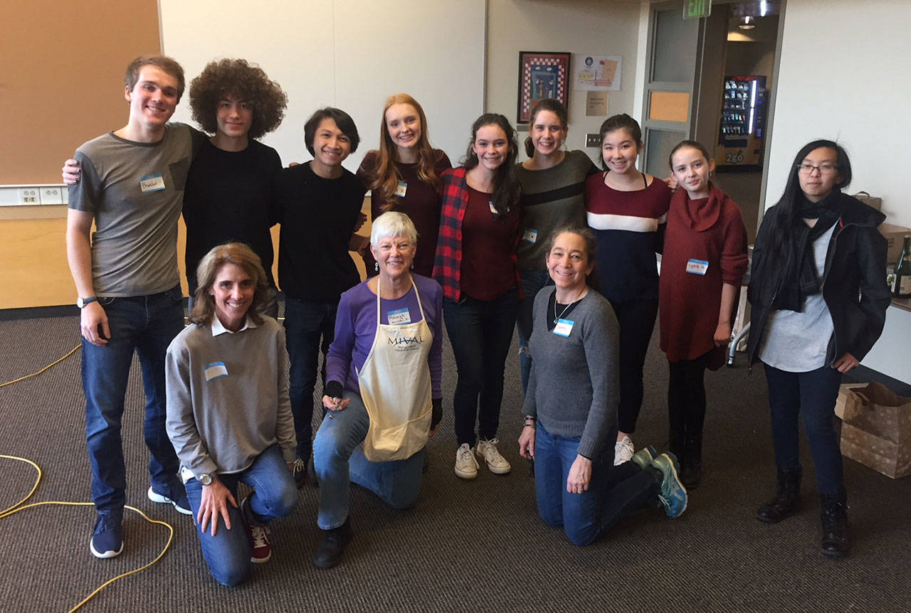 MIVAL Jr. members Brandon Hill, Cooper Wilce, Nico Galvin,Libby Hetzel, Anna Zink, Ellie Gottesman, Zoey Byers, Lydia Hogg, Stephanie Tran, along with volunteers Nancy Hill, Raleigh Nowers and Anne Hritzay (in the front row), smile after a second successful holiday workshop. Photo courtesy of Raleigh Nowers