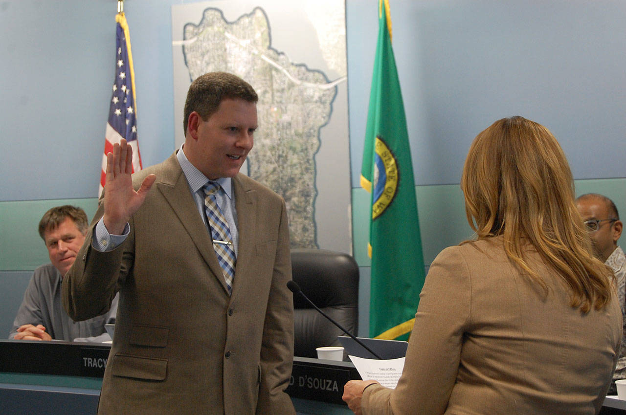 Superintendent Donna Colosky swears Brian Giannini Upton into Position 2 on the Mercer Island School Board on Dec. 14. Katie Metzger/staff photo