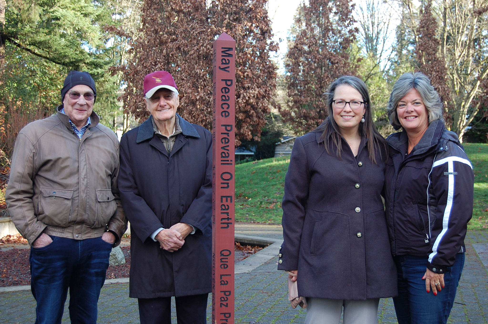 Mercer Island Rotary members Bo Darling, Orm Sherwood, Claudina Campbell and Beth Baska pose next to a peace pole, installed in Rotary Park on Dec. 20. Rotary is planning locations for more. Katie Metzger/staff photo