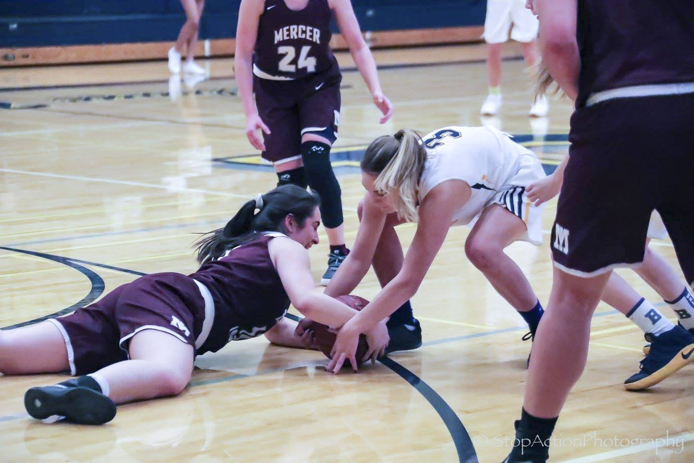 Photo courtesy of Don Borin/Stop Action Photography                                Mercer Island Islanders junior guard Angelina Barokas, left, dives for a loose ball against the Bellevue Wolverines on Jan. 3. Bellevue defeated Mercer Island 53-19 in a matchup between rivals.