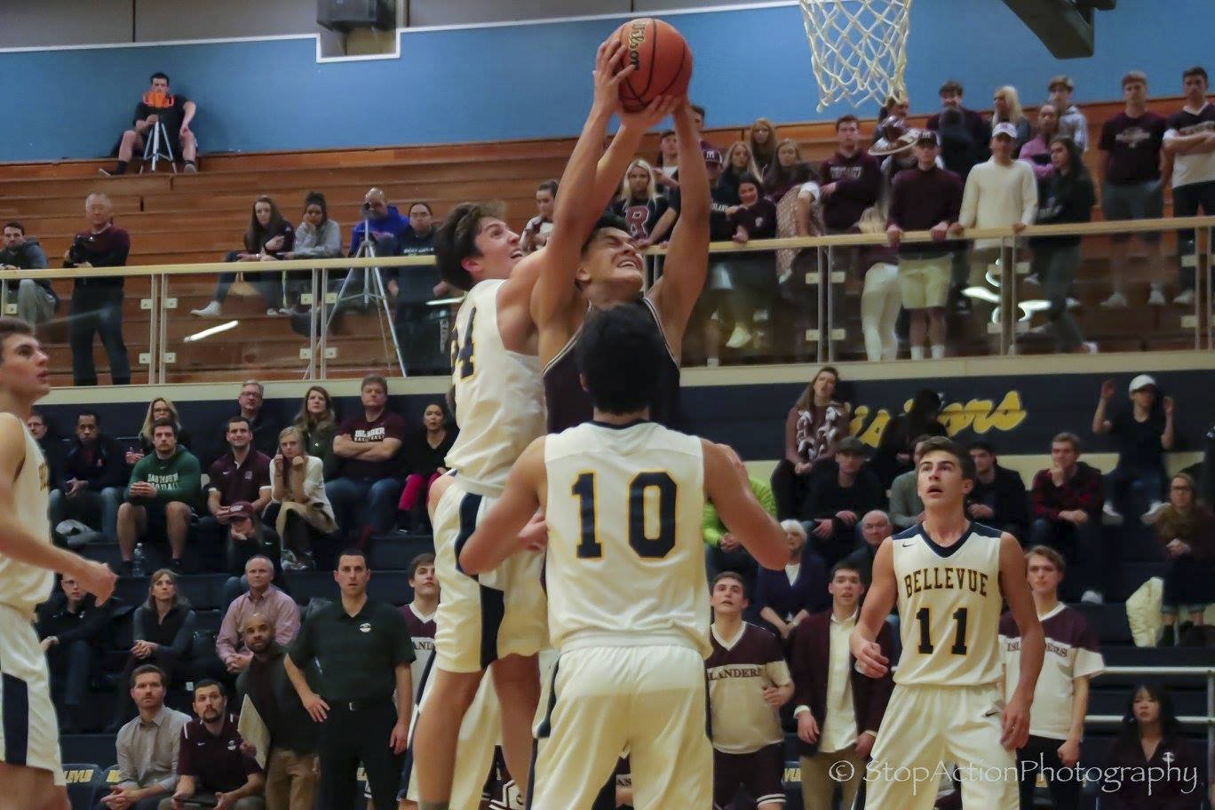 Photo courtesy of Don Borin/Stop Action Photography                                Mercer Island senior forward Giovanni Cervantes-Rocha, center, secures a rebound against the Bellevue Wolverines on Jan. 3. Bellevue defeated Mercer Island 61-57 in a matchup between rivals.