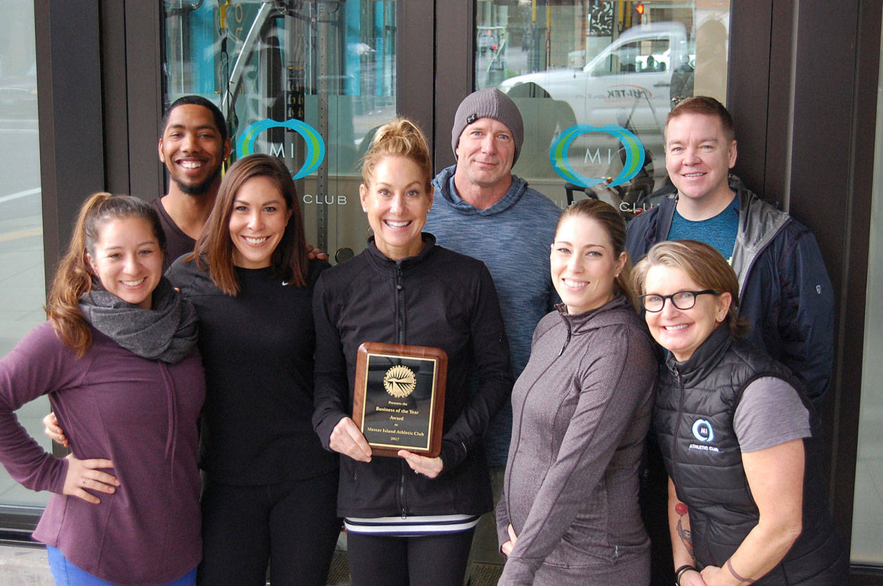 MI Athletic Club founder and owner Ginny Pietila poses with members of her staff: Liz Resendez, David Perkins, DJ Sughrim Kylee Freimuth, Samantha Amador, Sheri Hancey and Brian Vander Stoep (staff not pictured are: Amy Green, Meghan Desmul, Earl Davis, Kjersten Franklin, Cat DeHaven, Karen Swift Zoe Dodds and Katie Sipiorski). Katie Metzger/staff photo