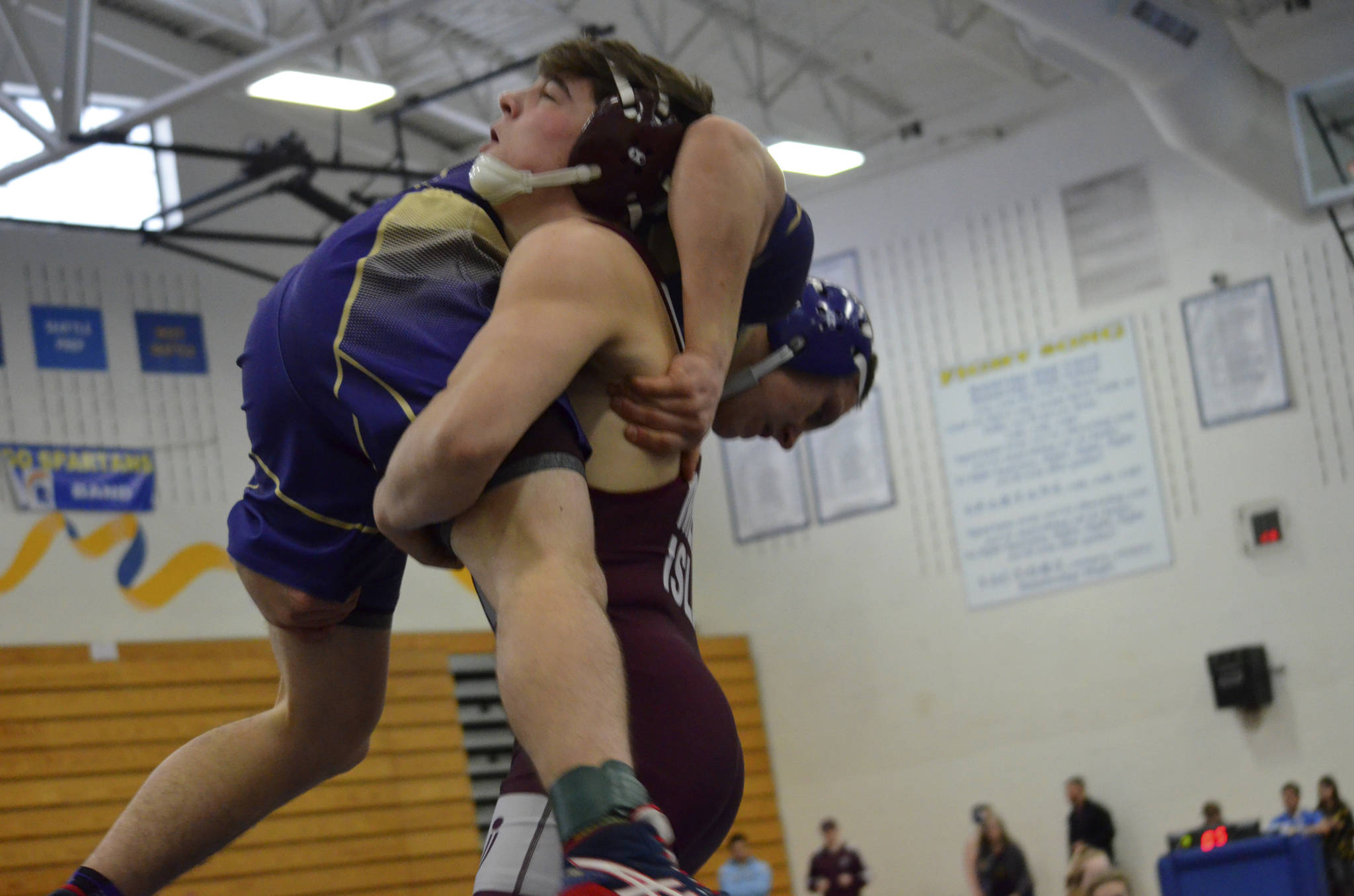 Photo courtesy of Billy Pruchno                                The Mercer Island wrestling team earned a 45-6 victory against the Bellevue Wolverines and a 57-12 victory against the Juanita Rebels on Jan. 9. Islanders wrestlers capturing victories against Bellevue consisted of Connor Pettigrew (forfeit), Jordan Tillinger (decision), Andrew Motz (pin), Eli Pruchno (pin), Vinny Ricci (pin), Jonah Andrews (forfeit), Liam Farrell (forfeit) Donnie Howard (pin) and Connor Hill (forfeit). Mercer Island grapplers registering wins against the Rebels consisted of Pettigrew (forfeit), Tillinger (decision), Motz (forfeit), Pruchno (pin), Mattias Harnay (forfeit), Ricci (pin), Andrews (pin), Farrell (forfeit), Howard (pin) and Hill (injury default). Andrews (pictured) takes down Juanita grappler 160-pounder Xavier Fontenot in a dual match.