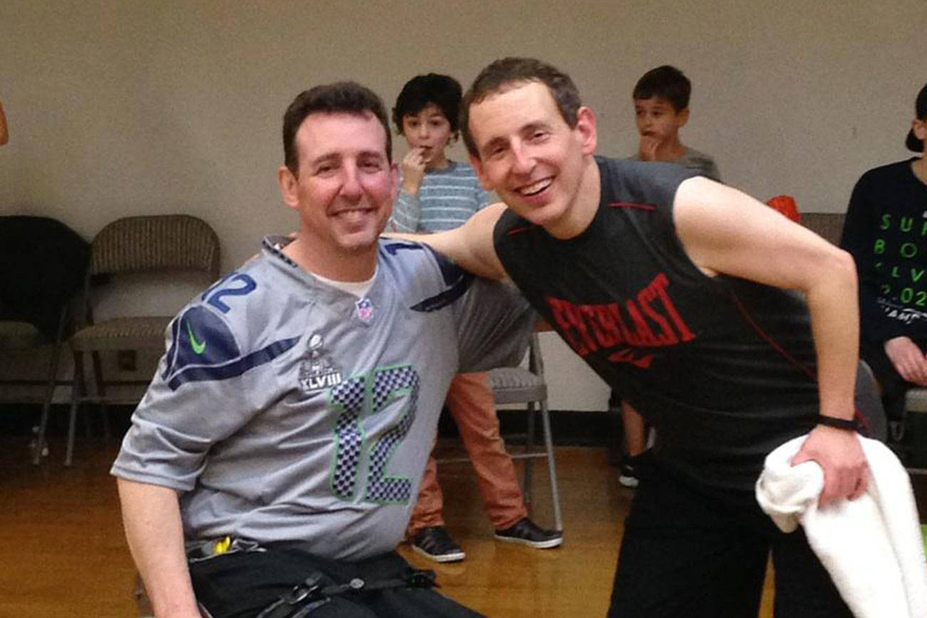 Photo courtesy of David Schiller                                David Schiller, right, poses for a quick picture with his brother Mike at a previous Free Throws for MS fundraiser on Mercer Island.