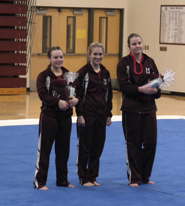 Photo courtesy of Martha Phelps                                The Mercer Island gymnastics squad captured a 155-146 victory against the Liberty Patriots on Jan. 18 on senior night at Mercer Island High School. Mercer Island improved its overall record to 4-2 with the win. Ava Motroni earned second place in All-Around. Junior Kaela Fukano nabbed second place on Bars. Islanders’ seniors Sophia Tiscornia, Leah Wooton and Tess Ritcey are pictured in the photo.