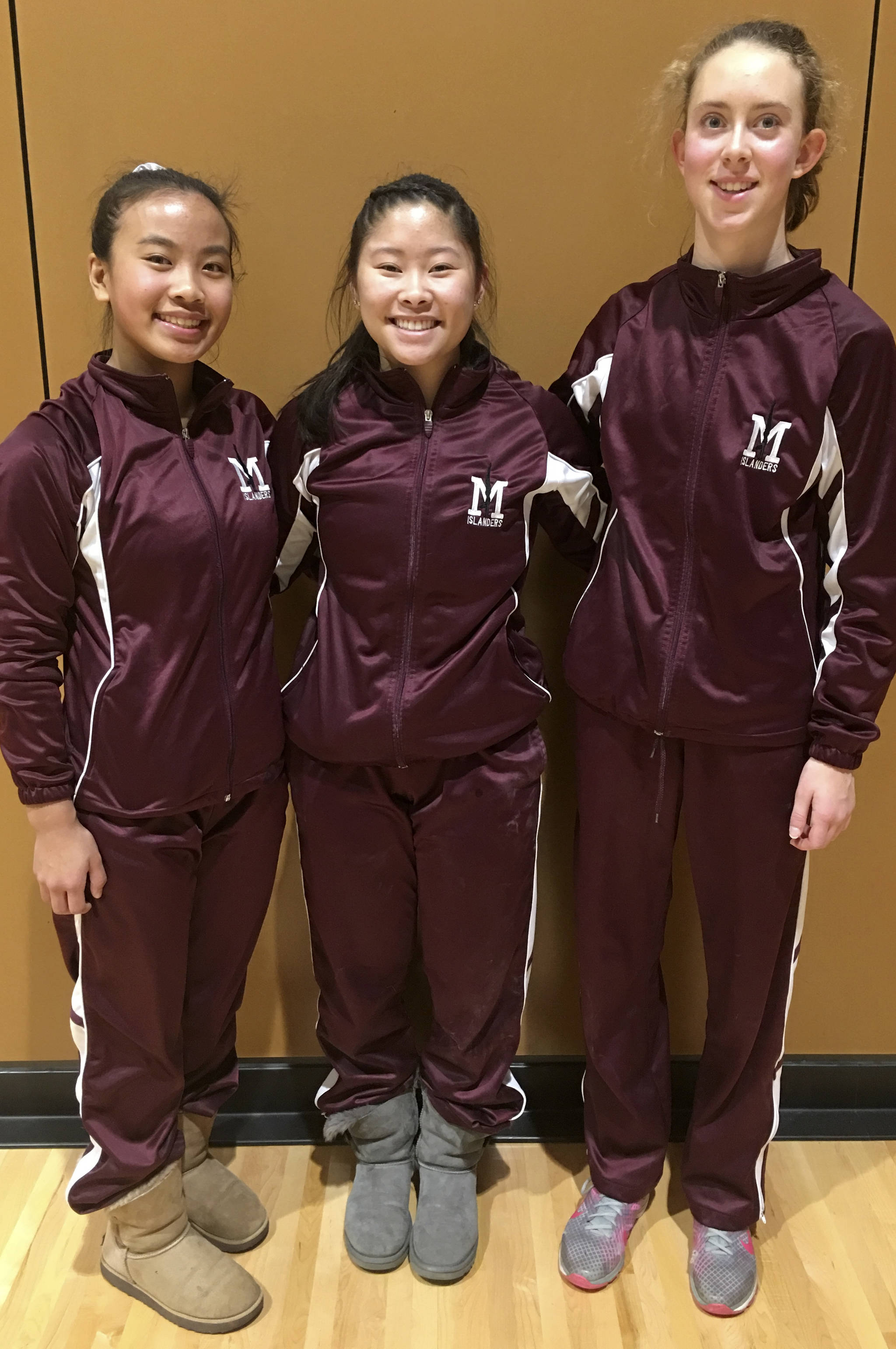 Photo courtesy of Martha Phelps                                The Mercer Island Islanders gymnastics team earned a 156-79 win against the Redmond Mustangs on Jan. 25. The Islanders improved their regular season overall record to 5-2 in dual meets with the victory. Freshman Ava Motroni captured first place in vault, beam and in all-around. Junior Mya Levin earned second place in vault, beam and all-around. Freshman Susie Lepow registered a first place finish on bars. Motroni, Levin and Lepow are pictured in the above photo.
