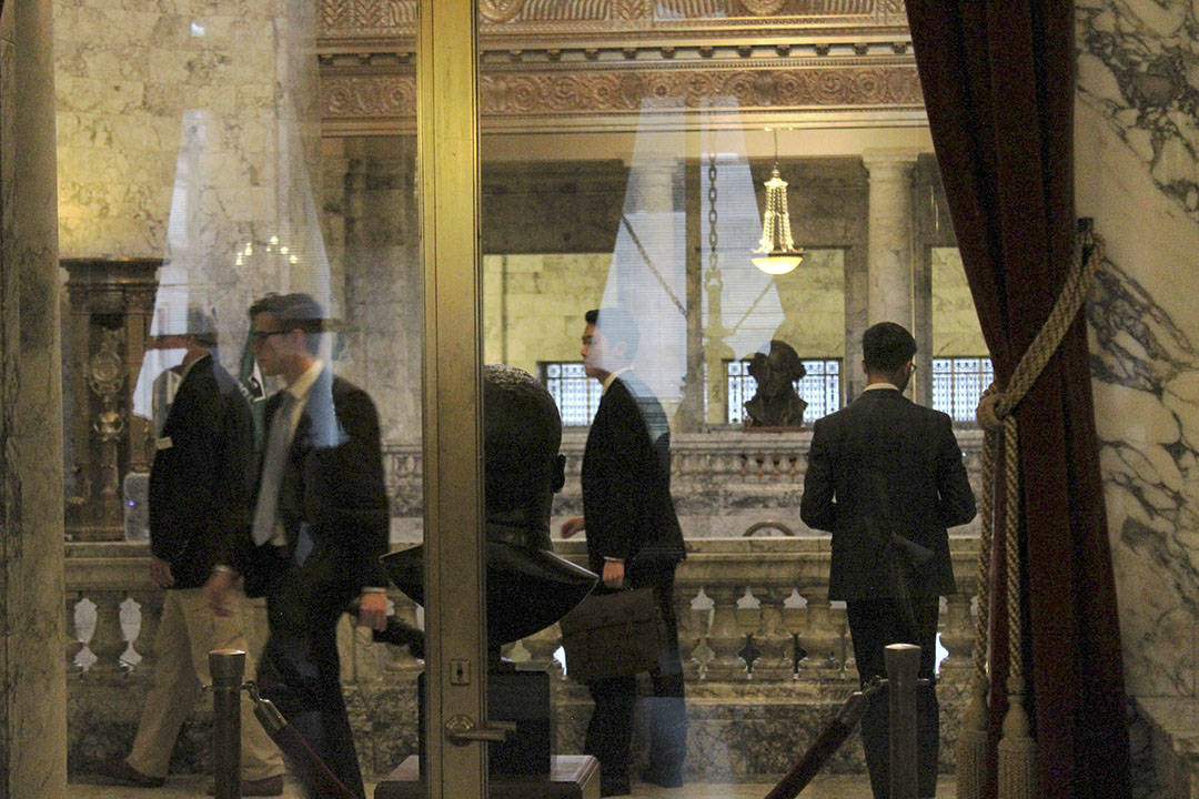 University of Washington students walk to their meeting in the state reception room in the capital building in Olympia. Photo by Taylor McAvoy