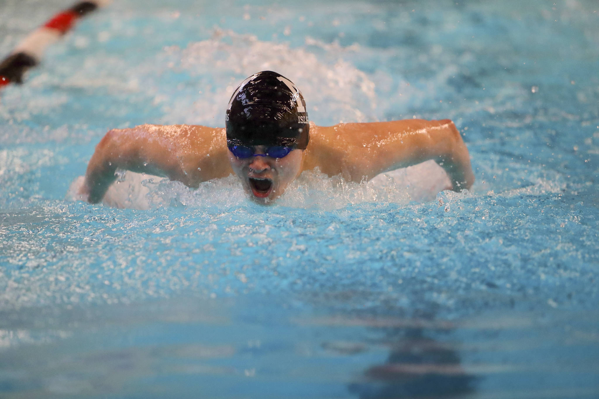 Photo courtesy of Jay Na                                The Mercer Island Islanders cruised to a 115-61 win against the Bellevue Wolverines in the regular season finale on Jan. 25. James Richardson (pictured) earned first place in the 100 fly. Mercer Island improved their overall record to 7-0 in dual meets with the win. Mercer Island head coach Evan Moline is looking forward to the postseason in the pool.                                “Our undefeated season has been great and it shows the true depth that we have on this team. We haven’t gone undefeated in the regular season in a few years now but we definitely aren’t done,” Moline said. “We know we have some work to do, but we are still focused on what we set out for this year, which is a state championship. We want to bring back the culture of success that I was lucky enough to experience back when I was on the team.”                                The 200 medley relay quartet of Alex Edwards, Kyle Bailey, Carson Coe and Richardson captured first place. The 200 free relay team of Killian Riley, Nate Robinson, Oliver Hoff and Coe cruised to a first place finish. The 400 free relay team of Riley, Richardson, Robinson and Hoff earned first place. Islanders capturing first place in individual events were Colin Ralston (200 IM, 100 breast stroke), Jake Headrick (500 free) and Richardson (100 backstroke).