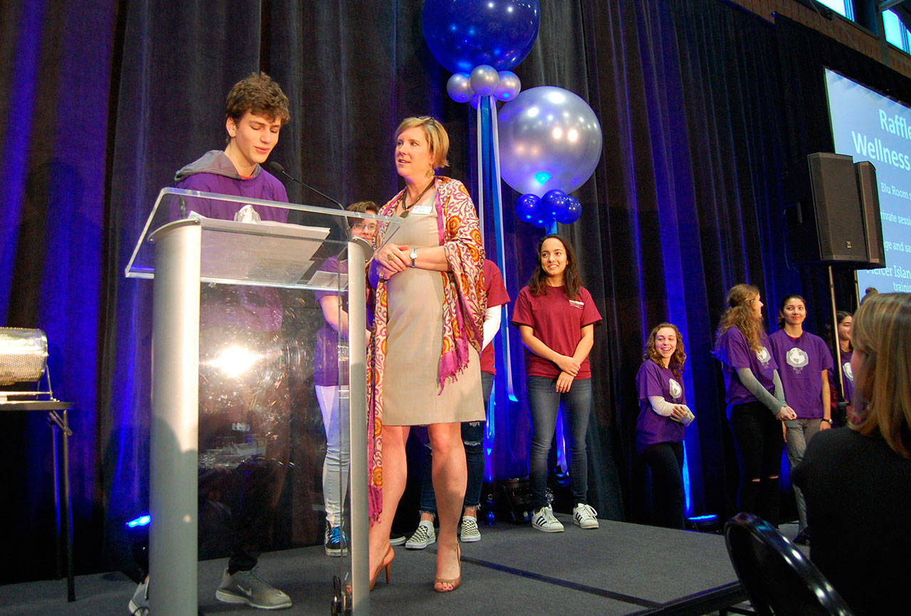 Jody Kris, who stepped in as the master of ceremonies at the MIYFS Annual Breakfast on Feb. 7, oversees the announcement of the raffle winners. Katie Metzger/staff photo