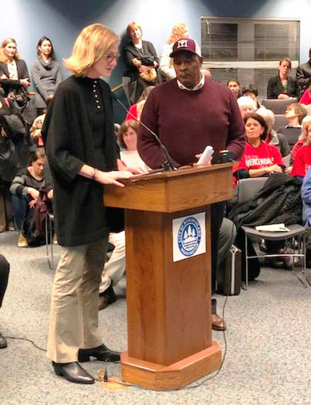 Mercer Island Mayor Debbie Bertlin presents the African American History Month proclamation to Reverend Wayne Perryman, a Mercer Island resident and minister active in regional equality and discrimination issues, on Feb. 6 at City Hall. Photo courtesy of the city of Mercer Island
