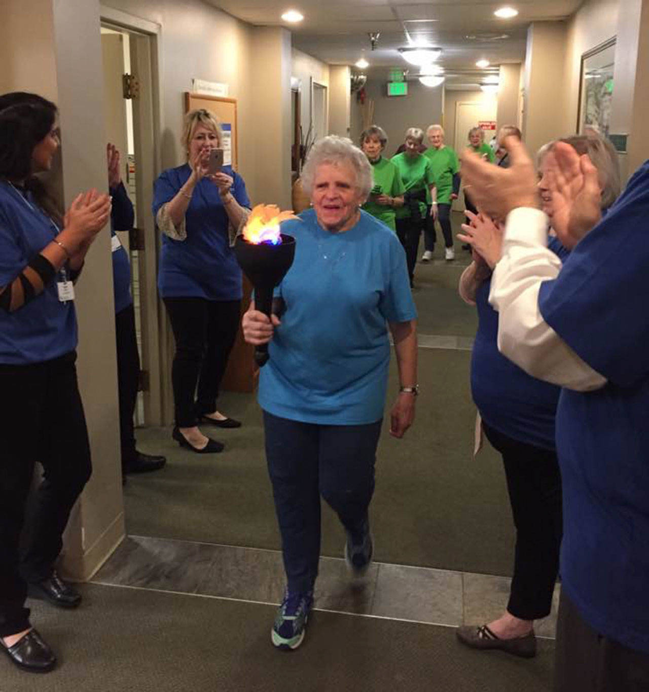 Residents and staff participate in the opening ceremony of the 2018 Shores Winter Olympics, encouraging fitness and health in the Covenant Shores retirement community. Photo courtesy of Janet Robinson