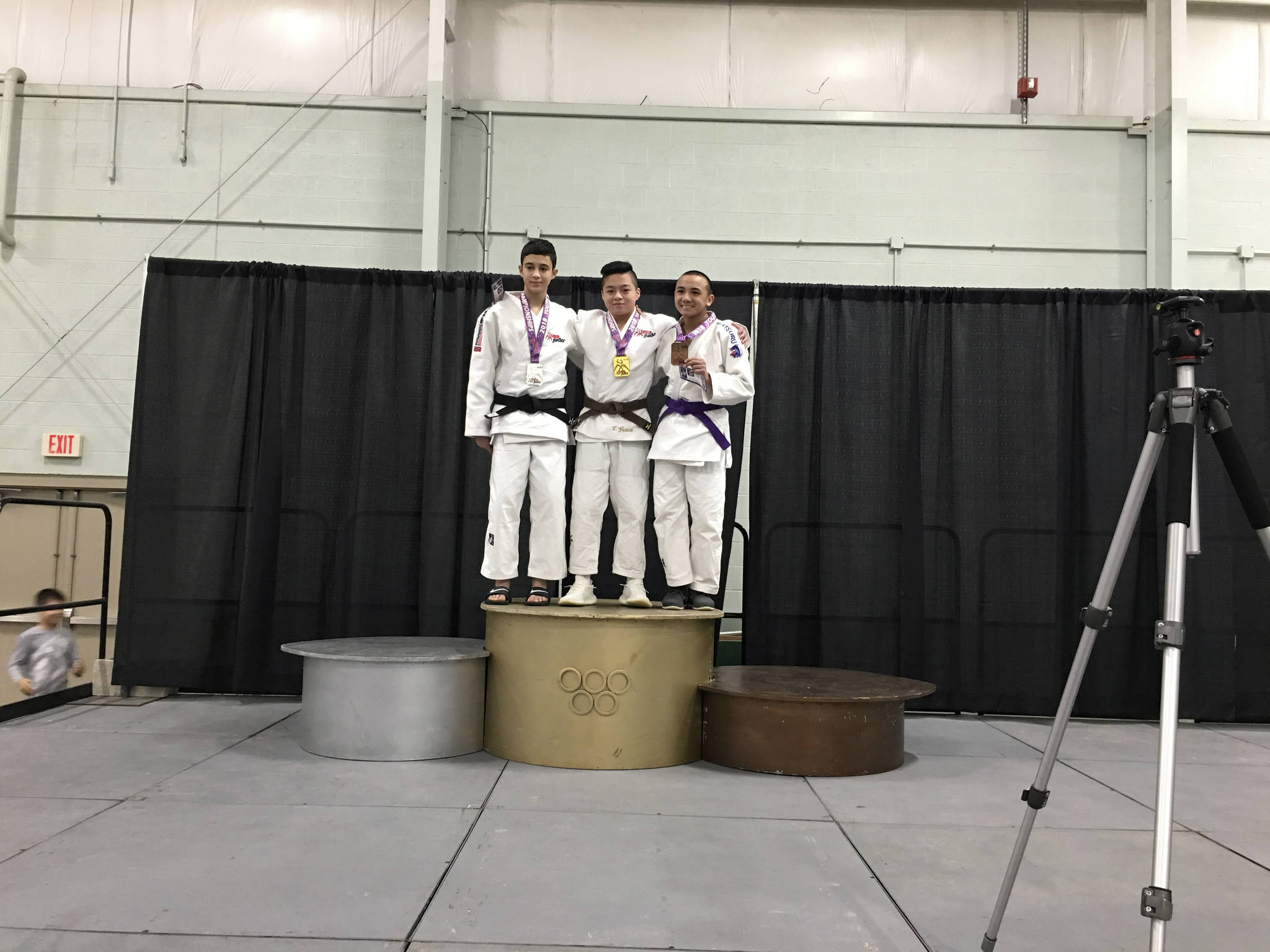 Photo courtesy of Mark Yuasa                                Mercer Island Islanders freshman Tegan Yuasa, center, earned first place in the Cadet -50 kilogram division at the USA Judo Scholastic National Championships on March 3-4 in York, Pennsylvania. Yuasa will also represent Team USA at the 2018 Cadet Pan American Championships on July 6, 2018 in Buenos Aires, Argentina.