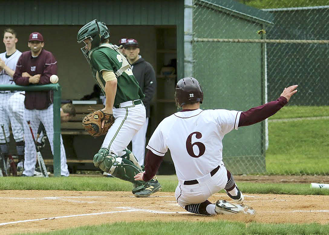 Greg Fuchs slides safely into home plate in a contest against the Redmond Mustangs during the 2017 season. Fuchs will be a senior on the Islanders baseball team in 2018. He will play college baseball at Oregon State University next season. Courtesy of Jim Nicholson