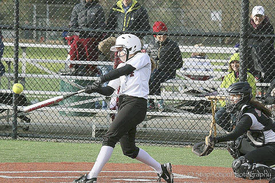Islander Olivia Kane connects on a hit against the Sammamish Totems in a game on March 22, 2017. Courtesy of Don Borin/Stop Action Photography