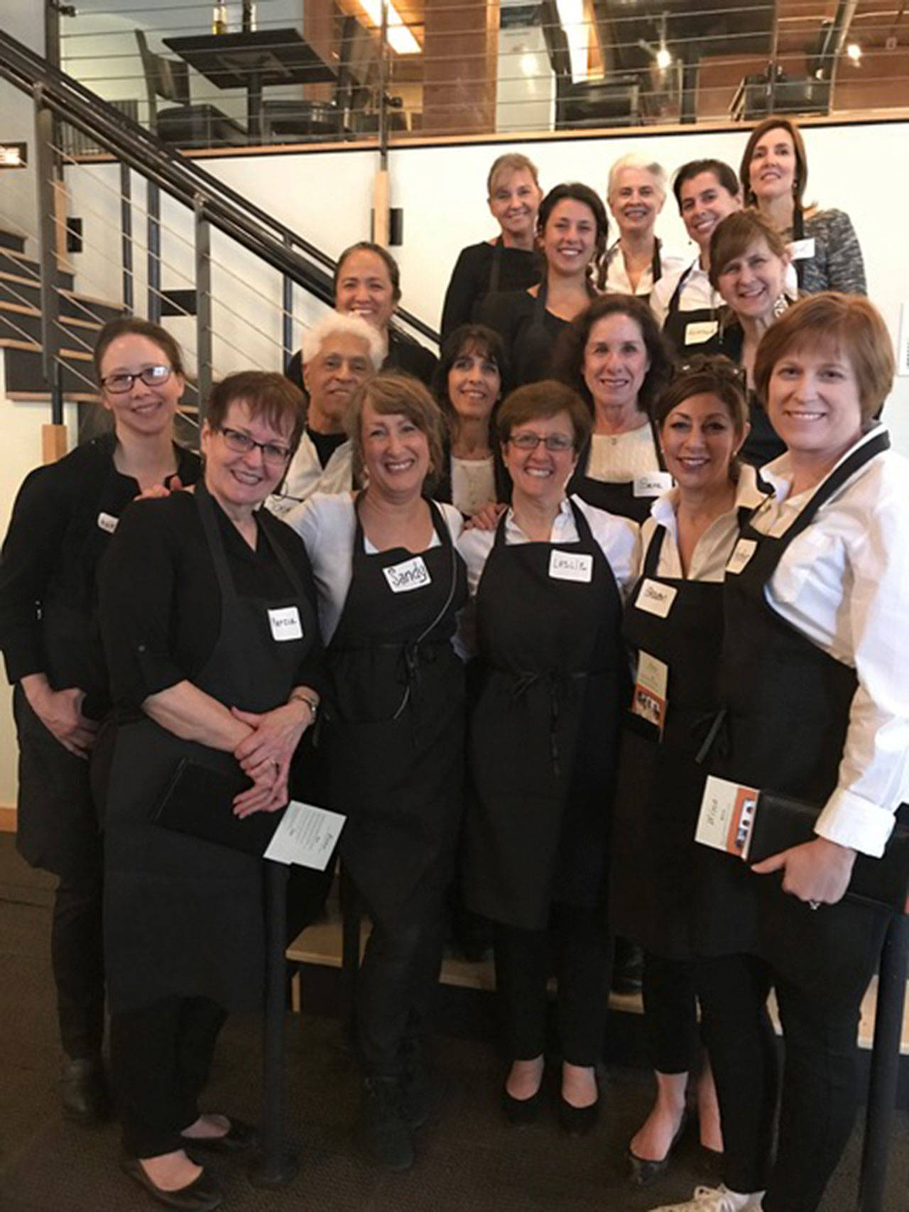 Sandy Glass Mosaics led 17 volunteers to serve meals at FareStart’s Guest Chef Night on March 15. Courtesy photo