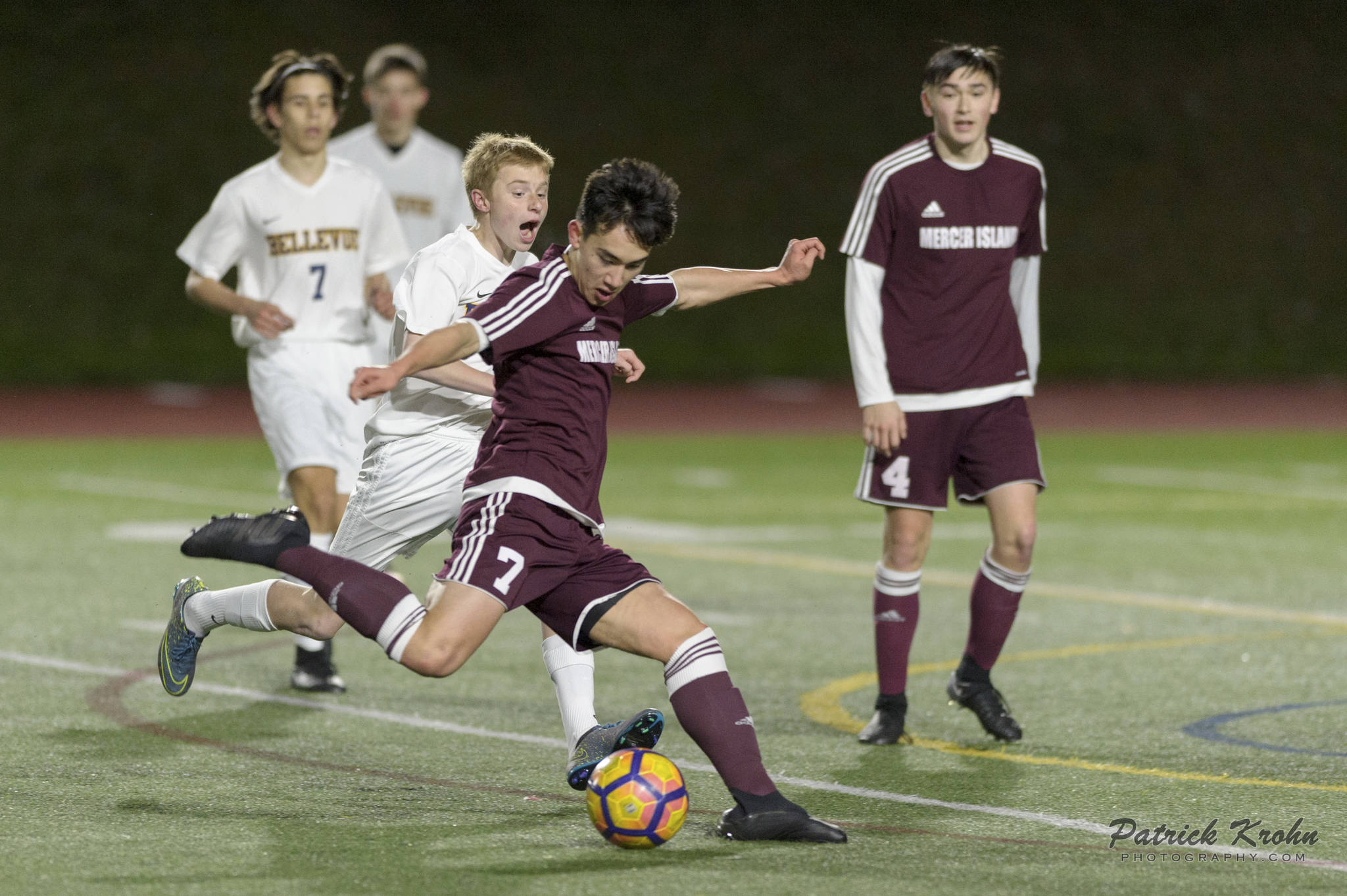Photo courtesy of Patrick Krohn/Patrick Krohn Photography                                Mercer Island junior midfielder Dakota Promet takes a shot on goal against the Bellevue Wolverines in a KingCo 3A/2A contest on March 23 at Bellevue High School. The Islanders and Wolverines battled to a 0-0 draw.