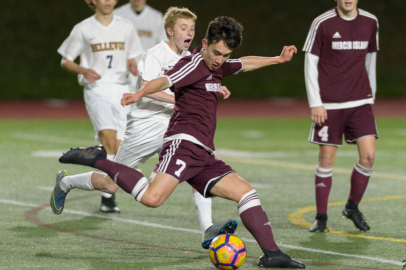 Photo courtesy of Patrick Krohn/Patrick Krohn Photography                                Mercer Island junior midfielder Dakota Promet takes a shot on goal against the Bellevue Wolverines in a KingCo 3A/2A contest on March 23 at Bellevue High School. The Islanders and Wolverines battled to a 0-0 draw.