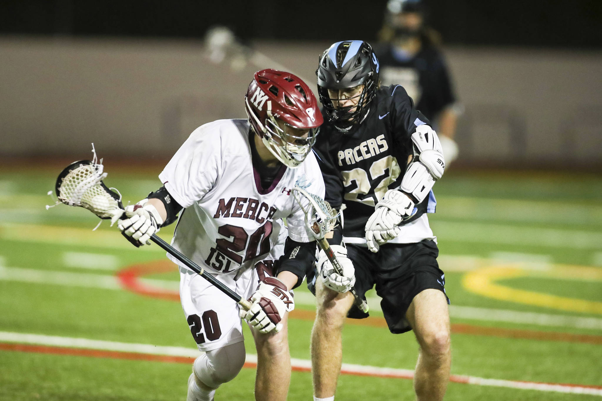 Photo courtesy of Rick Edelman/Rick Edelman Photography                                The Mercer Island Islanders boys lacrosse team earned their fifth win of the 2018 season courtesy of a 14-5 victory against Lakeridge on March 23. Mercer Island player Donnie Howard (pictured) controls the ball while being defended by a Lakeridge player.